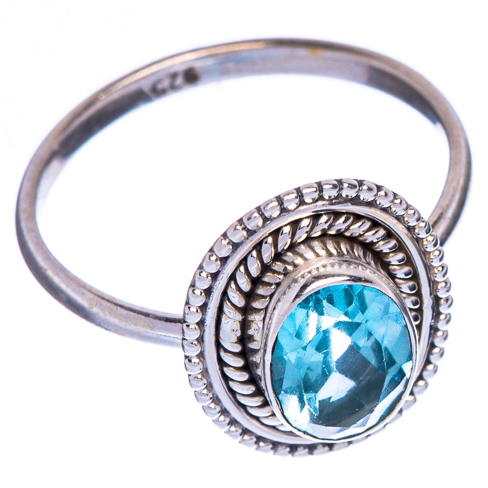 Sterling silver oval blue topaz ring with raised ornate bezel, side profile