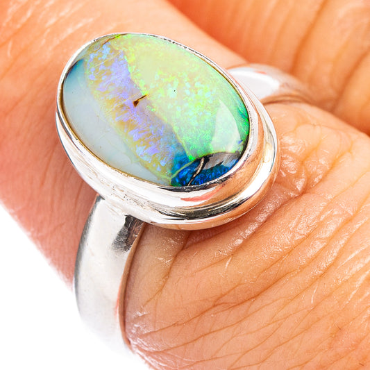 Sterling silver opal ring, close-up of oval iridescent stone on top setting