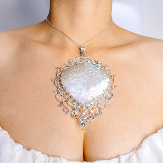 925 sterling silver mother-of-pearl pendant with ornate filigree border