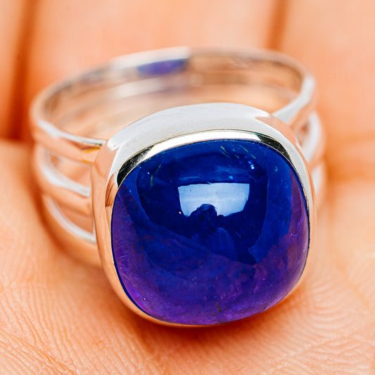 Sterling silver ring with large oval blue gemstone cabochon and open band