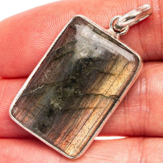 Rectangular labradorite pendant with silver-plated bail, dark iridescent stone