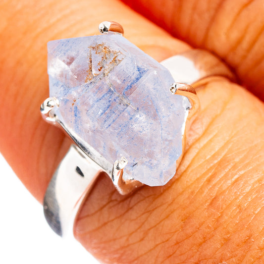 Sterling silver ring with faceted light-blue quartz and prong setting