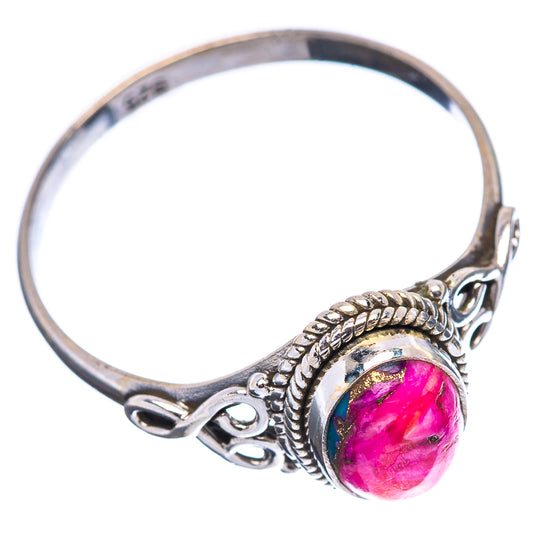 Sterling silver openwork oval ring with pink gemstone, braided border and side scrolls