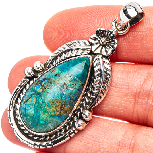 Teardrop turquoise opal pendant in .925 sterling silver with ornate leaf and flower details