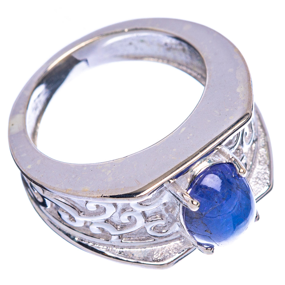 Oval blue tanzanite gemstone on sterling silver ring with carved band and openwork sides