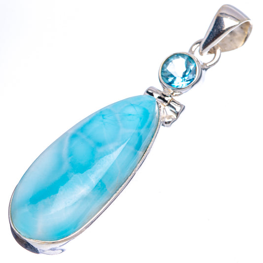 Sterling silver pendant featuring large oval blue larimar stone with blue topaz bezel detail