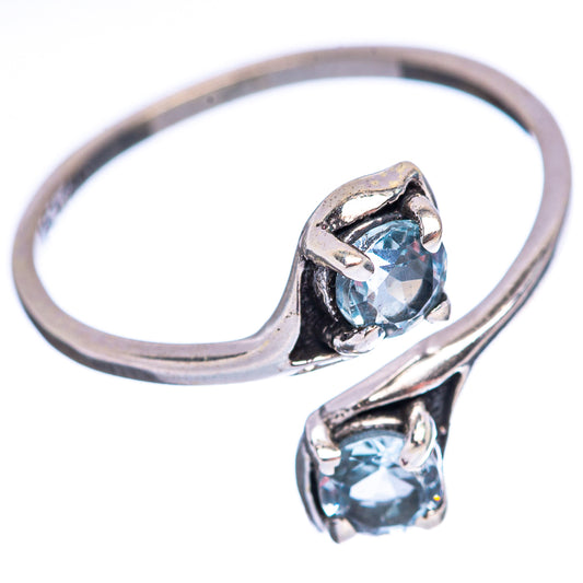 Sterling silver ring with two blue topaz stones in sculpted settings