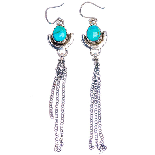 Turquoise dangle earrings with oval stones, crescent silver tops, and long chain fringe