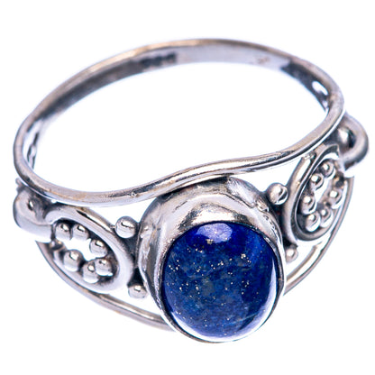 Sterling silver dainty ring with blue oval lapis cabochon and detailed filigree sides