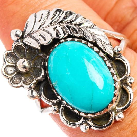 Turquoise oval sterling silver ring with leaf and flower engravings, size 8.