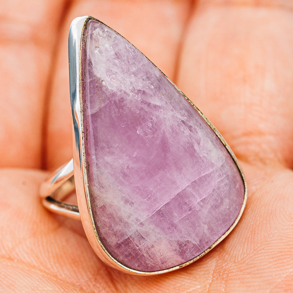 Lilac teardrop kunzite ring in silver prong setting with slim band, side view