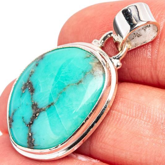 Turquoise oval pendant in .925 sterling silver with silver bail, close-up.