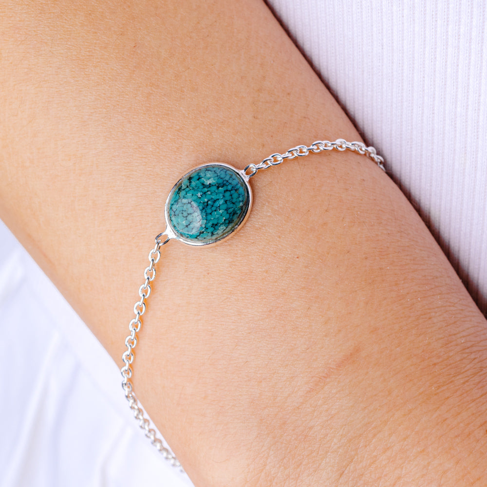 Sterling silver bracelet with round turquoise spiderweb cabochon and link chain