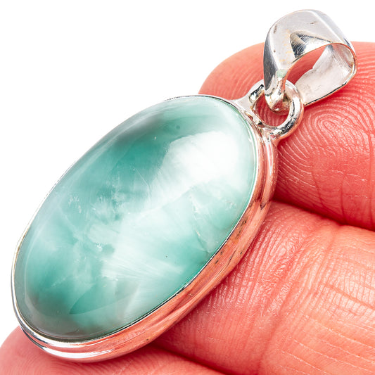 Sterling silver pendant with oval turquoise cabochon stone and bail loop