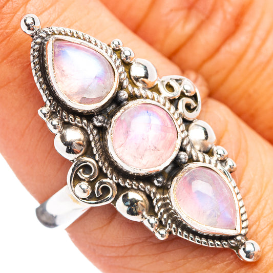 Sterling silver moonstone ring with three pink oval stones in ornate filigree