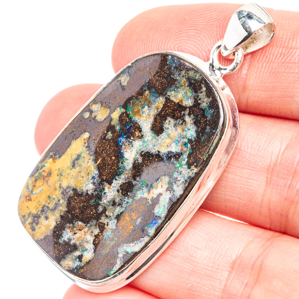 Oval boulder opal pendant with multicolor flecks and silver bail, 925 sterling silver