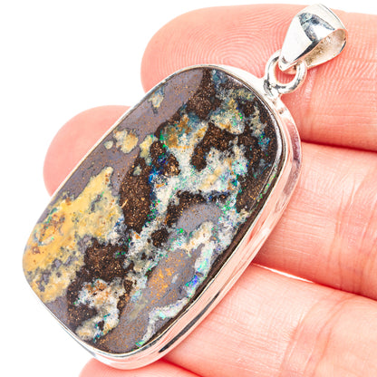 Oval boulder opal pendant with multicolor flecks and silver bail, 925 sterling silver