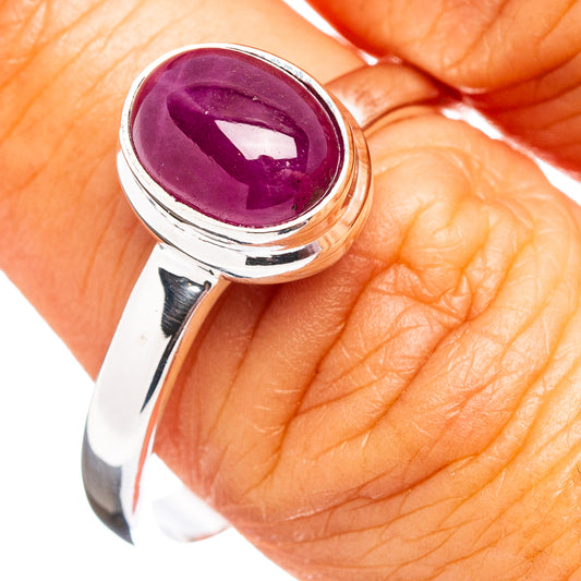 Oval purple ruby cabochon sterling silver ring with polished band