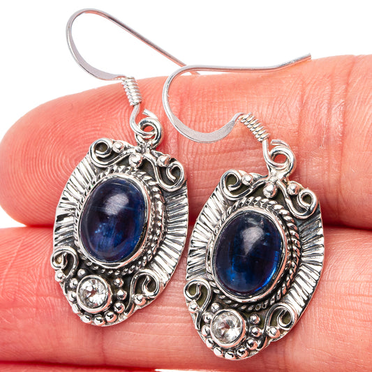 Sterling silver kyanite drop earrings: oval blue stone, ornate frame, fishhook backs