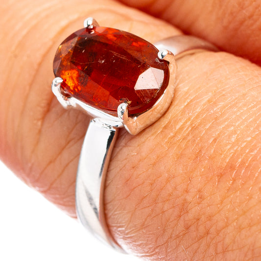 Orange kyanite sterling silver ring with oval faceted gemstone and three prongs
