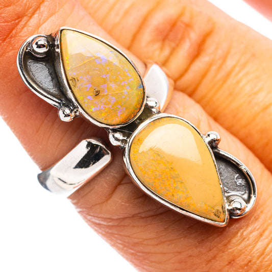 Sterling silver opal ring with two teardrop-shaped yellow opal stones, adjustable band