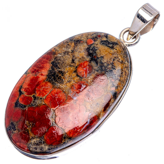 Sterling silver pendant with large oval red, tan and black gemstone, rounded bail