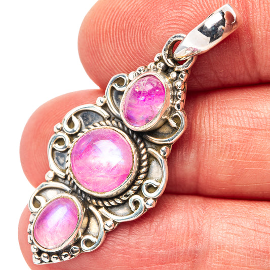 Pink moonstone pendant in .925 sterling silver with three oval pink stones, halo frame