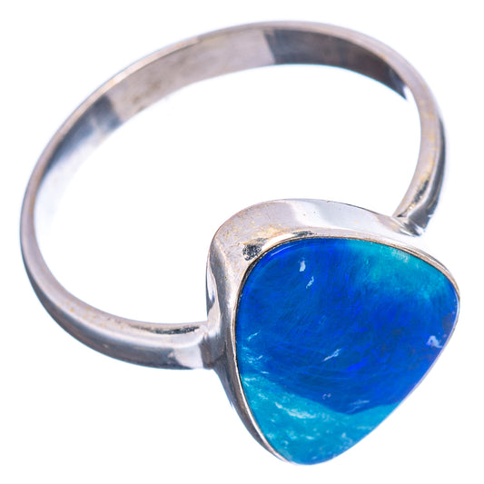 Heart-shaped blue opal doublet ring with silver band, side view