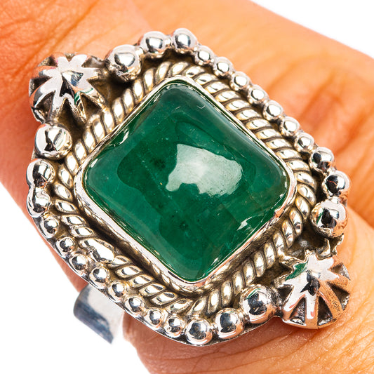 Green emerald cabochon ring with beaded silver setting and star accents