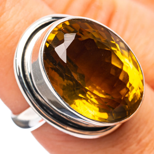 Sterling silver ring with oval faceted amber quartz, close-up top view