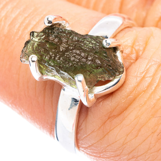 Sterling silver ring with rough green moldavite stone, open prong setting