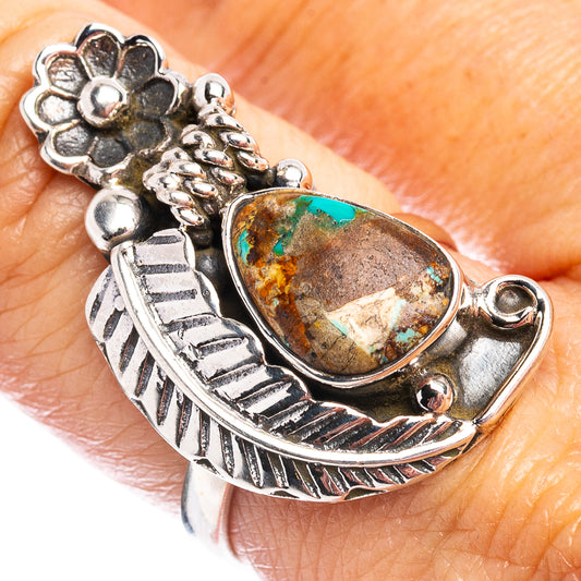 Sterling silver ring with oval turquoise stone and engraved floral details