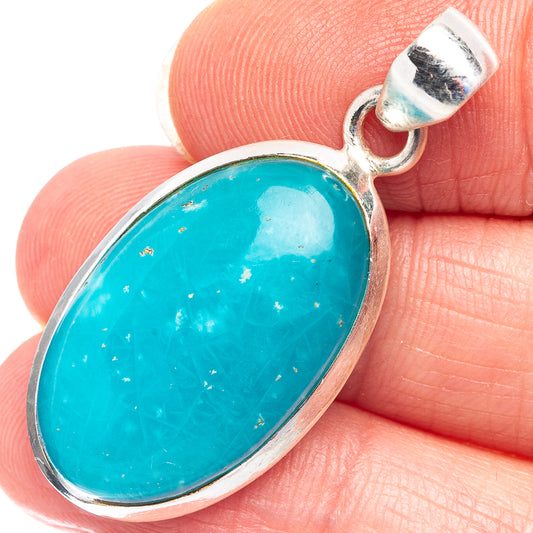 Close-up oval turquoise gemstone pendant with .925 sterling silver bezel and bail