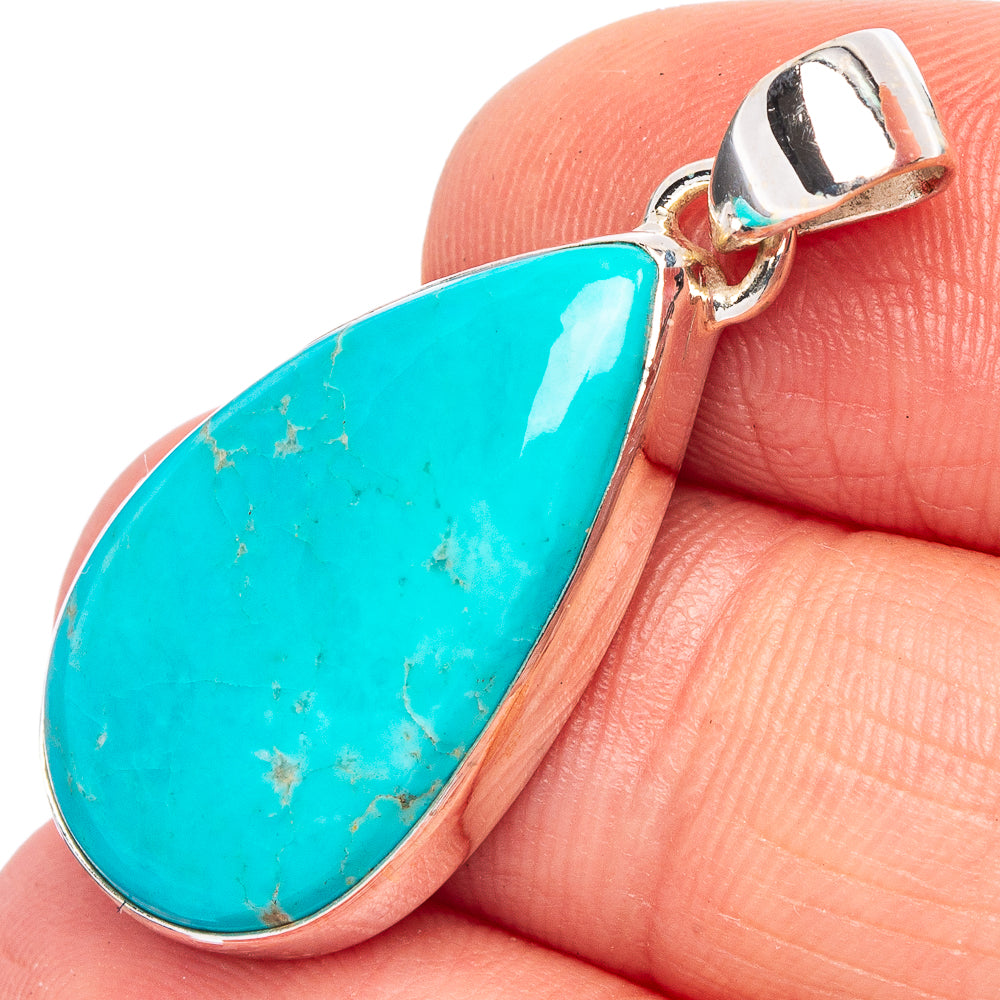 Sterling silver turquoise teardrop pendant with bezel setting and loop bail