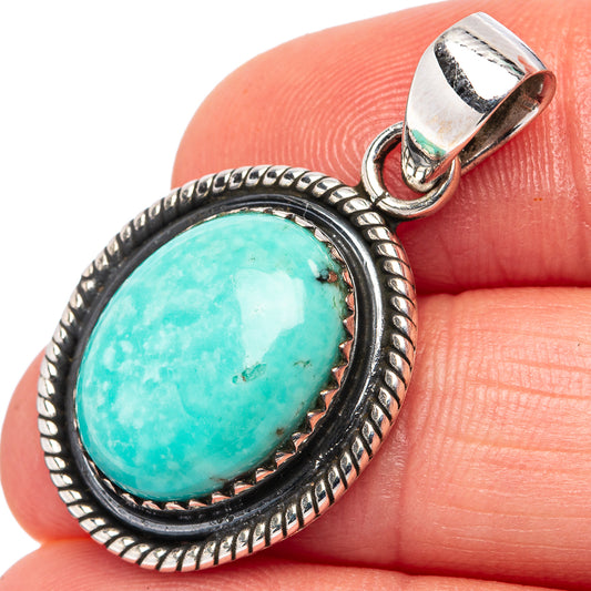 Turquoise cabochon pendant in .925 sterling silver with braided oval bezel