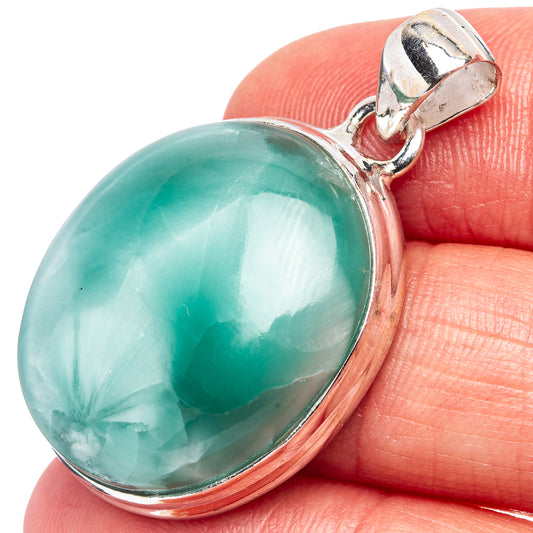 Sterling silver pendant with oval teal cabochon stone and hinged bail top
