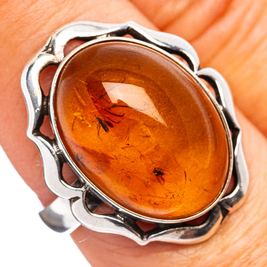 Sterling silver oval amber insect ring, warm reddish-brown stone, size 7.75