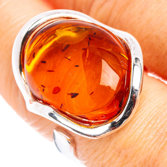 Amber cabochon ring in .925 sterling silver, adjustable band close-up