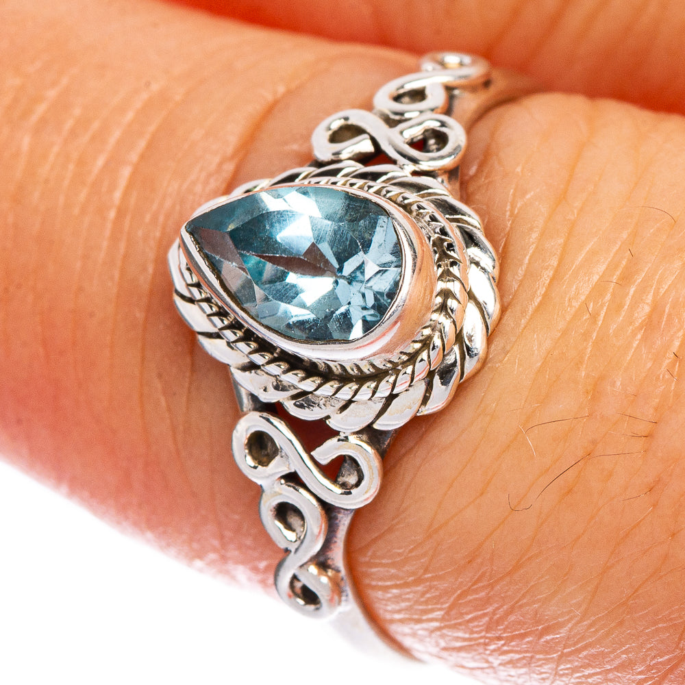 Sterling silver dainty ring with oval blue topaz gemstone centerpiece