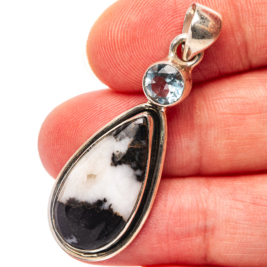 Sterling silver teardrop pendant with blue gemstone and white-black stone inlay