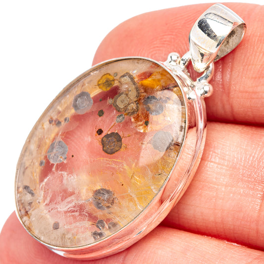 Oval sterling silver pendant with clear quartz and dark marcasite flecks, bail top