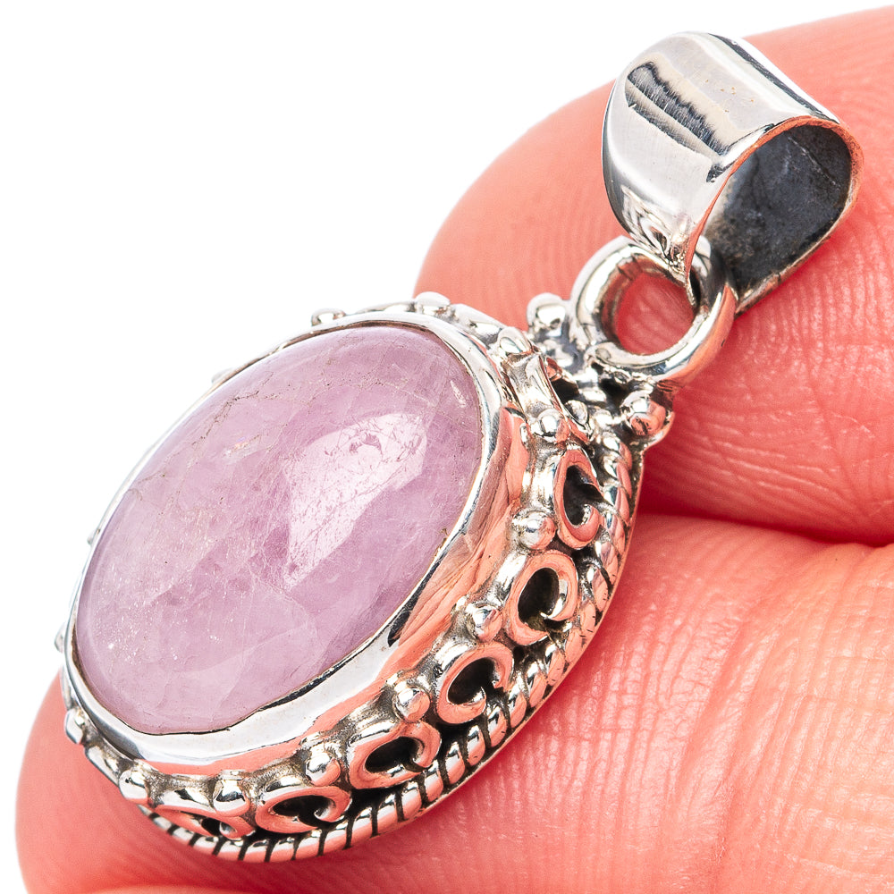 Oval pink kunzite pendant in 925 sterling silver bezel with ornate bail
