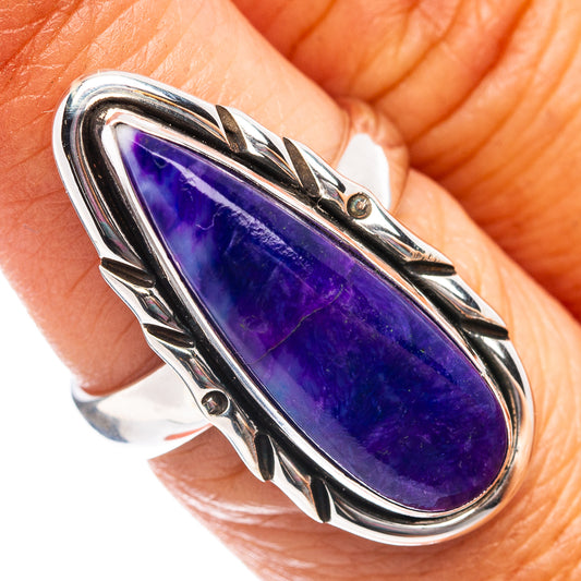 Sterling silver oval sugilite ring with purple gemstone in ornate bezel