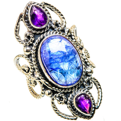 Sterling silver oval gemstone ring with blue center and purple side stones, ornate setting