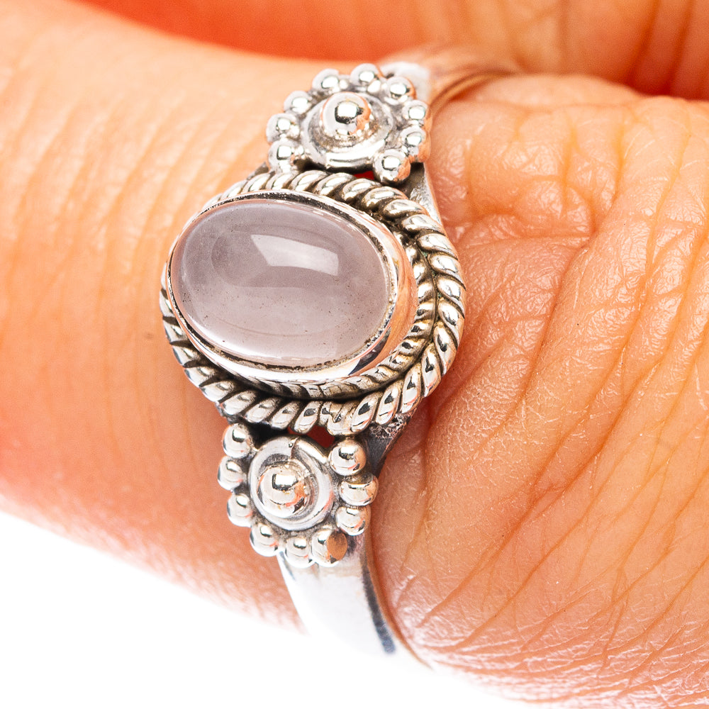 Dainty sterling silver ring with oval rose quartz cabochon and ornate bead setting