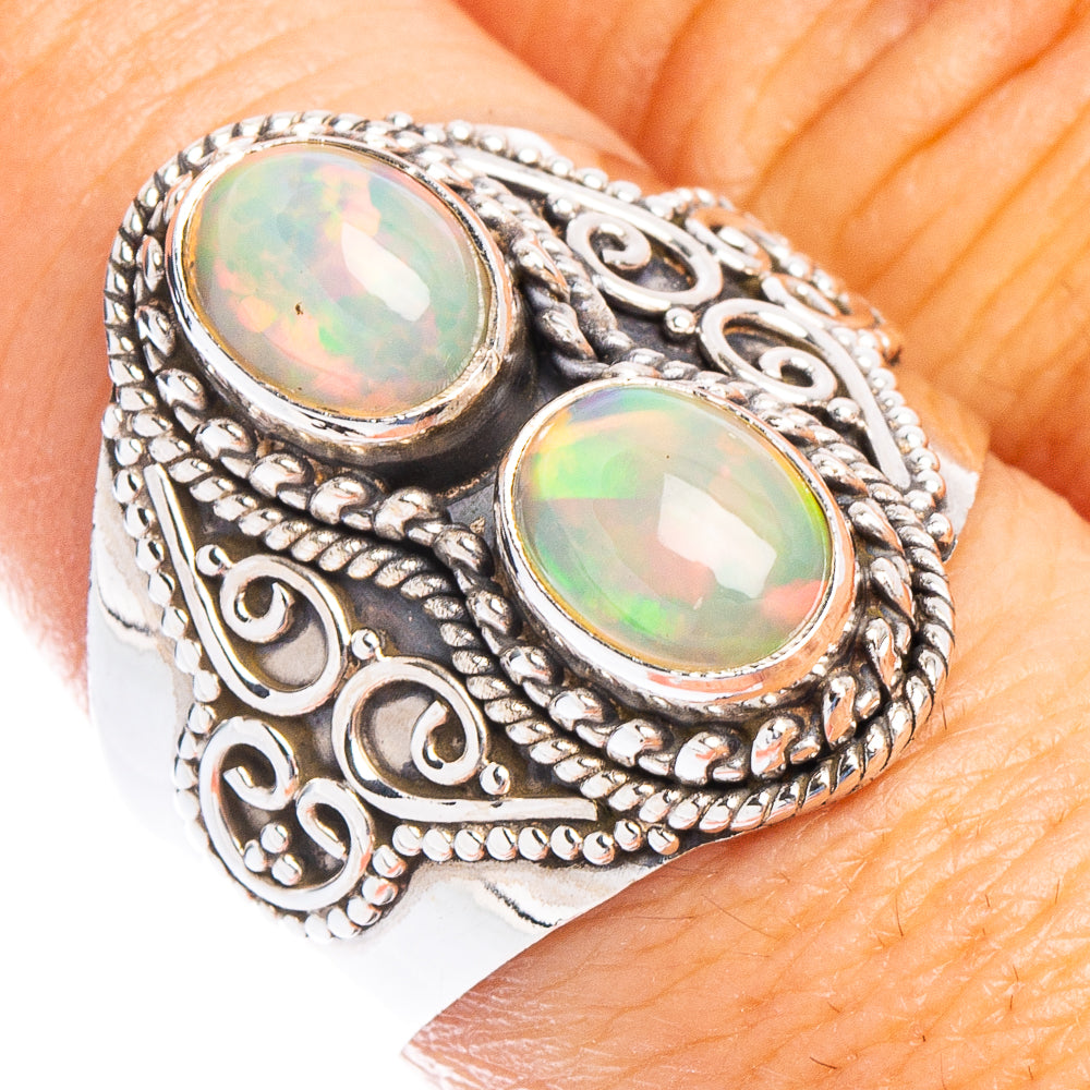 Sterling silver filigree ring with two oval iridescent opal cabochons