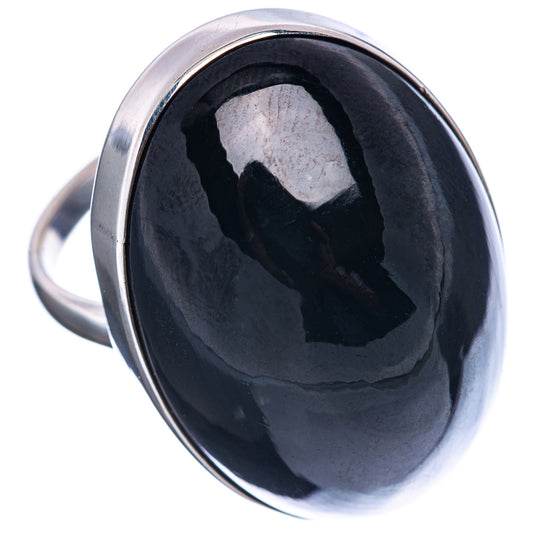 Sterling silver ring with round-oval black obsidian cabochon and mirror shine