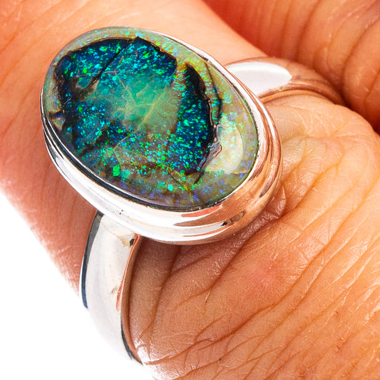 Sterling silver opal ring with oval green-blue iridescent stone, size 7