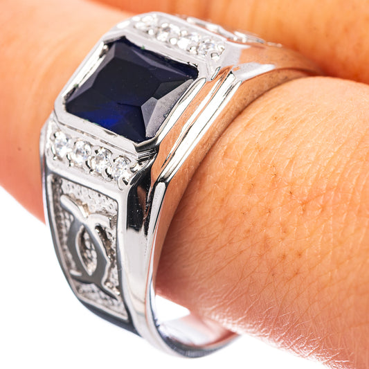 Sterling silver men’s ring with square blue gemstone and clear stone accents