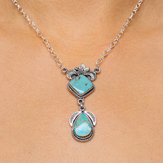 Turquoise pendant necklace with two oval turquoise cabochons on silver links
